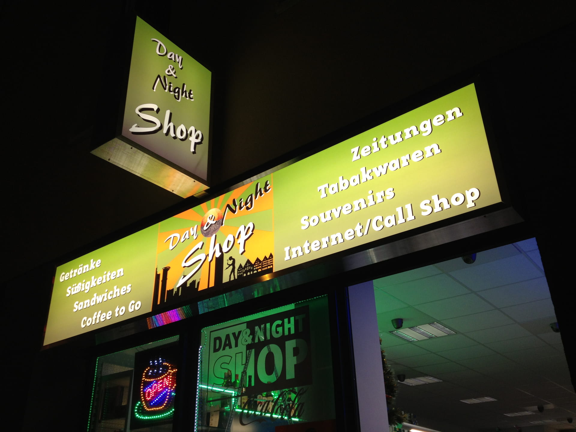 Illuminated banner and push-out light box with lettering in Neu Isenburg